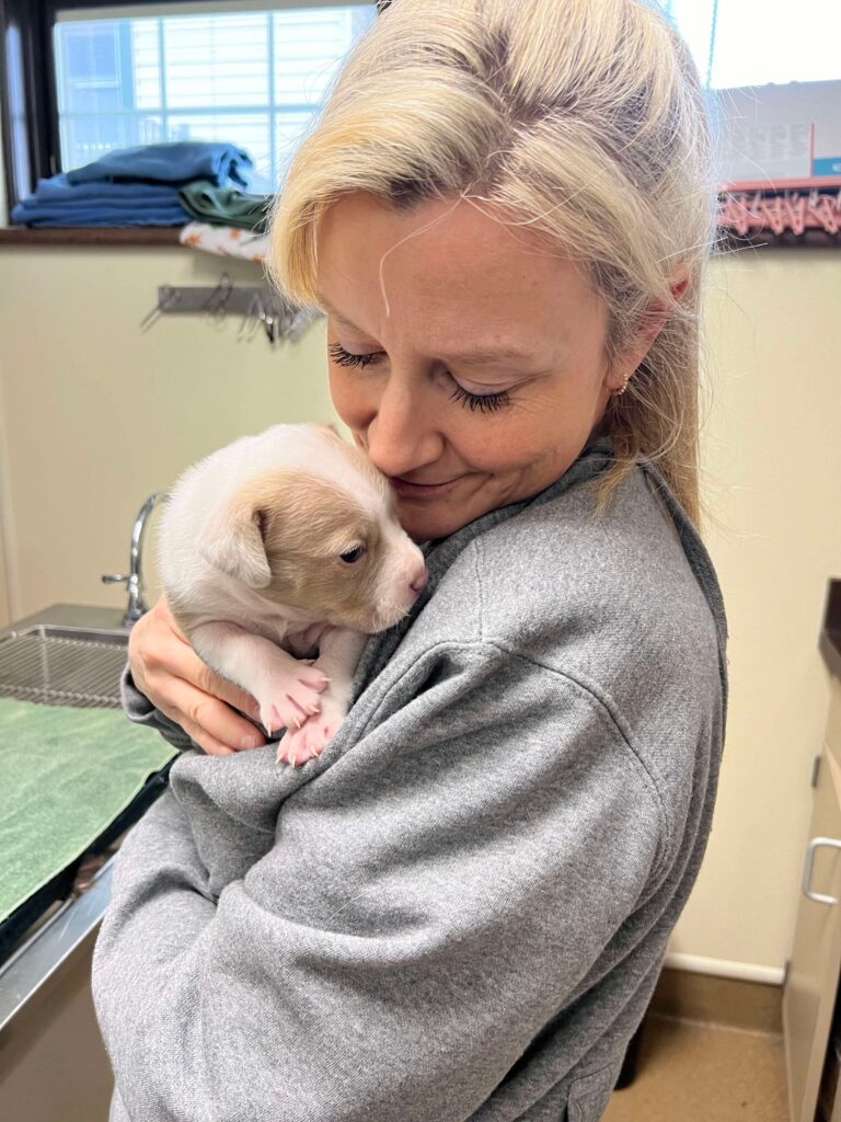 Dr. Bewley holding Peggy 2.19