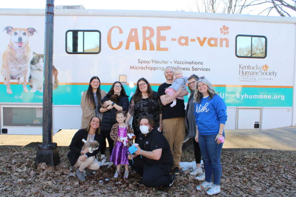 KHS Staff, Make a Wish Staff, and Ellie + her family in front of the KHS CARE-a-van.