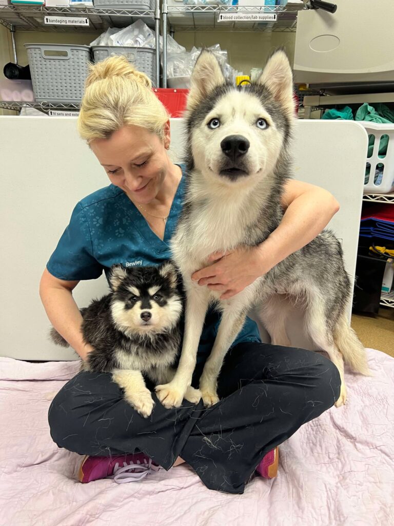 Dr. Bewley holding Miss Honey and Matilda